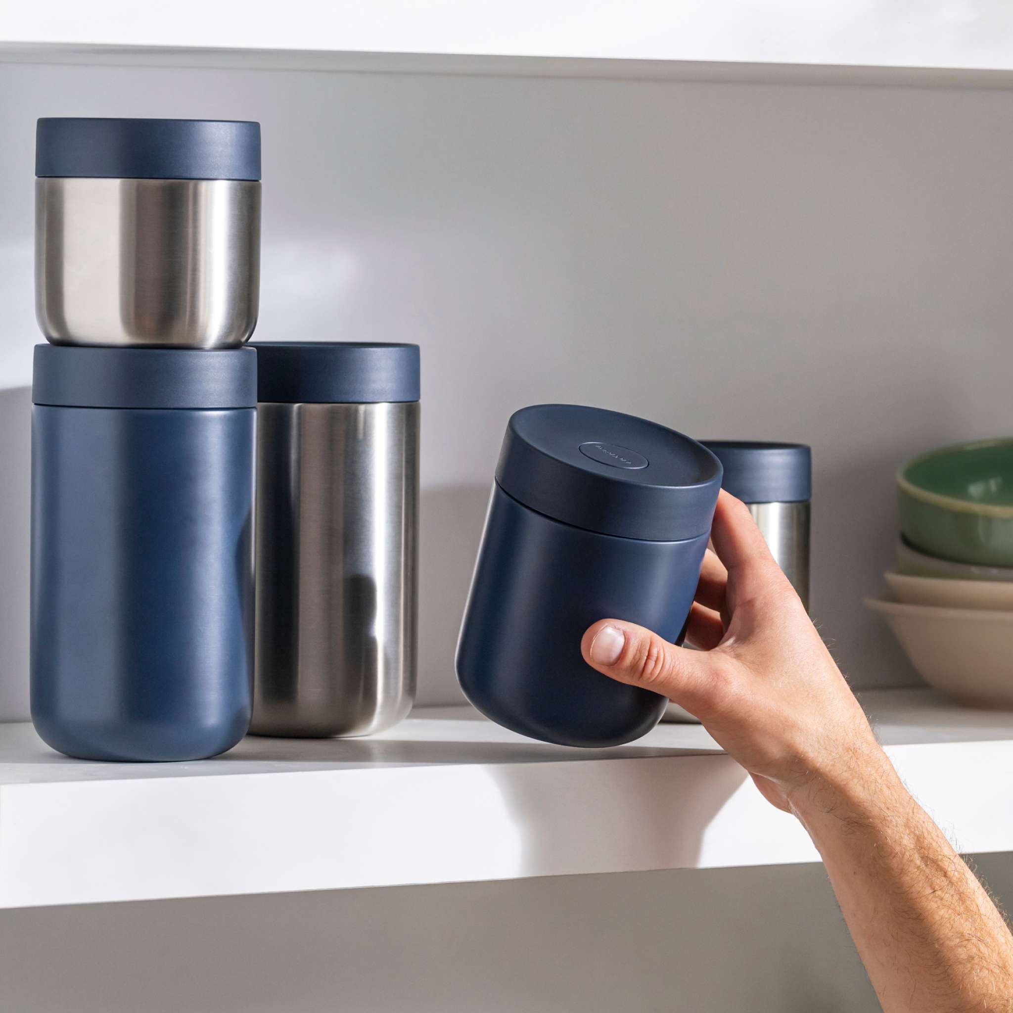 Nommie-snackable-food-jar-navy-in-use